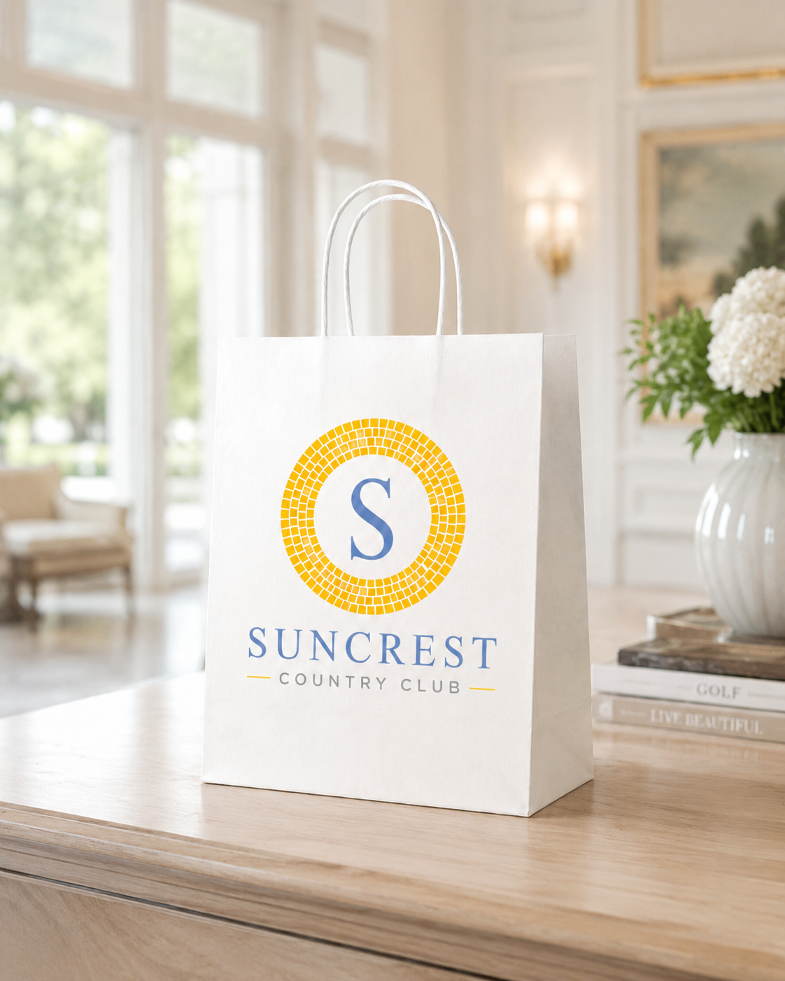 Medium white twisted handle paper bag with Suncrest Country Club branding